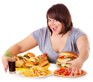  Woman eating fast food.